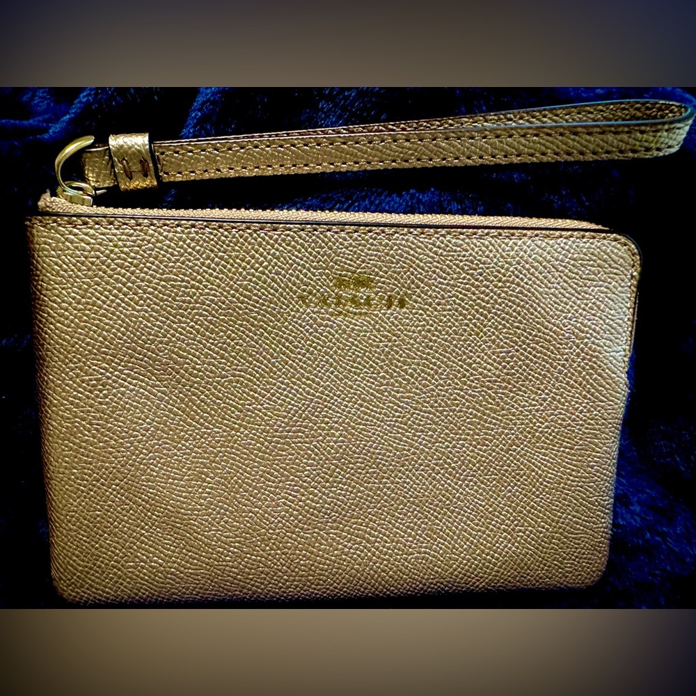 Coach Gold Wristlet with Textured Leather and Minimalist Design